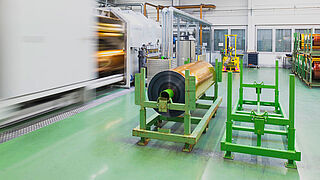 Manufacturing of a fully metallized security foil Image from inside the production plant showing the manufacturing of a fully metallized foil