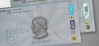 Image of sample banknotes with a KINEGRAM COLORS® Registered Stripe