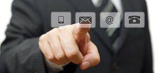 Image of an outstreched hand that reaches for an e-mail icon