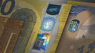 Opening the Windows to Security - The 200 and 50 Euro banknotes with KINEGRAM REVIEW® Stripe over Window Close-up of Window Area of 200 and 50 Euro banknotes with KINEGRAM REVIEW® security feature