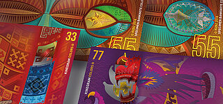 Close-up of four sample banknotes with ethnic designs and KINEGRAM COLORS® security features