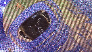 High-resolution close-up of a KINEGRAM® HDM showing an astronaut's face and helmet