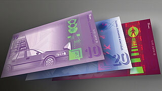 Close-up of three sample banknotes demonstrating the KINEGRAM VOLUME® technology