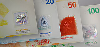 Sample banknote series with a design of the four elements and KINEGRAM® APL features